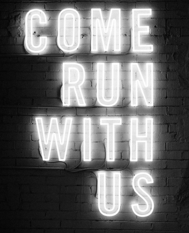 Photo by Hannes Egler white Come Run With Us neon signage
